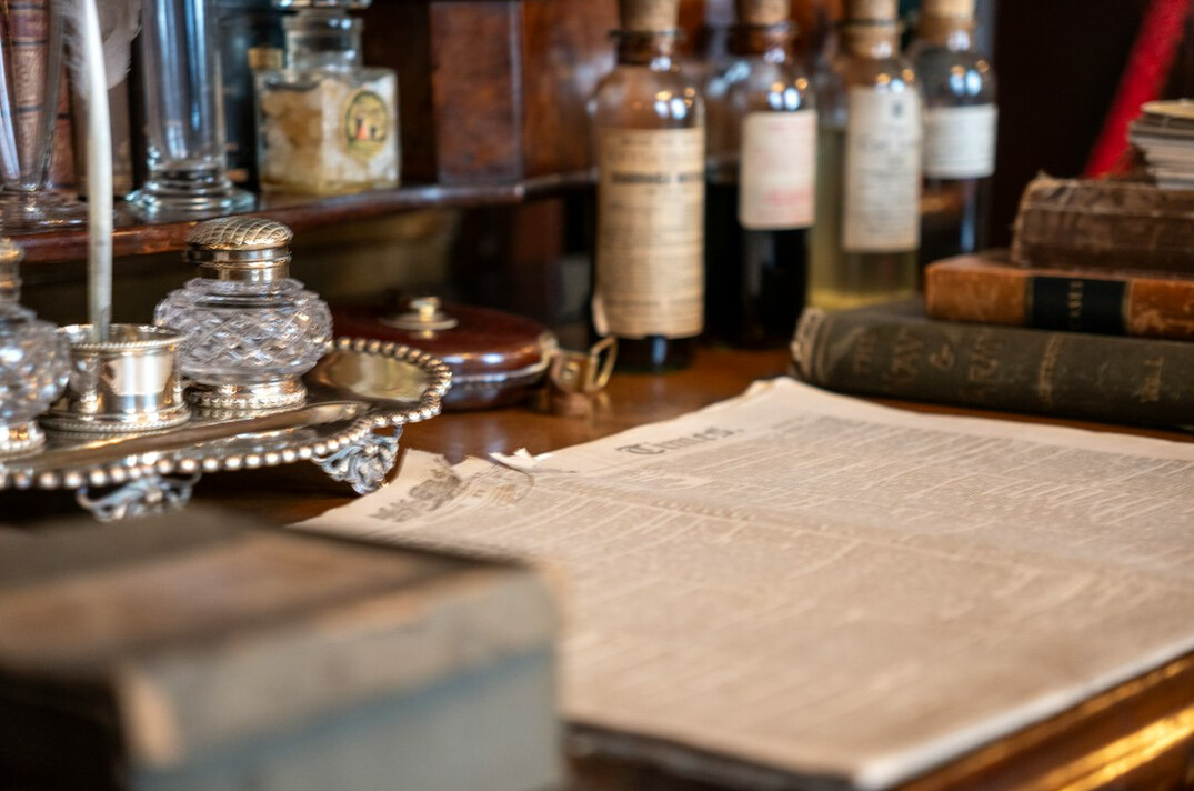 Detective's leather notebook with handwritten notes and a pen