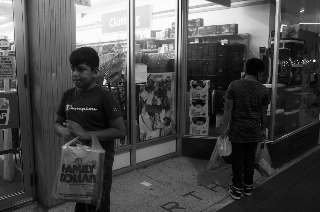 store detective watching shoppers