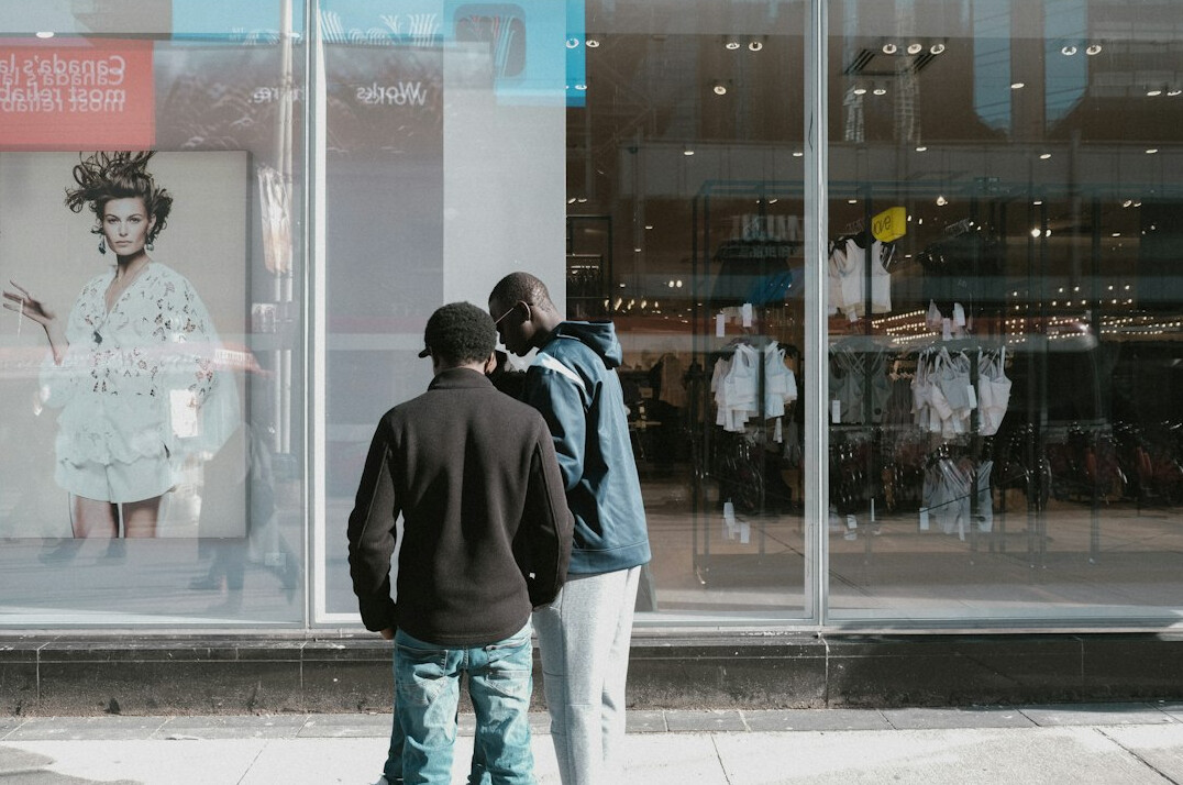 store detective watching shoppers